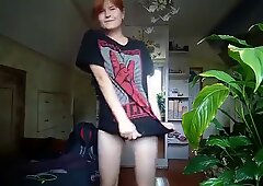 Horny redhead teen gets naked and shows her titties
