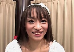 Funky Japanese babe chats to the camera in an interview